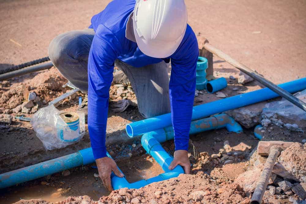 man doing pipe repairs in Kennesaw, GA