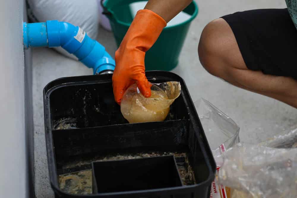 cleaning a grease trap