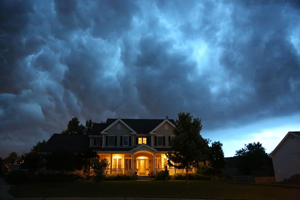 outside view of house with incoming thunderstorm