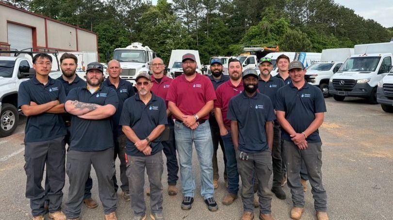 Integrated Plumbing specialist with their service vans prepared and ready for any plumbing emergency.